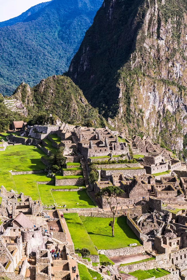 Machu Picchu Inca citadel surrounded by steep mountains in the Peruvian Andes