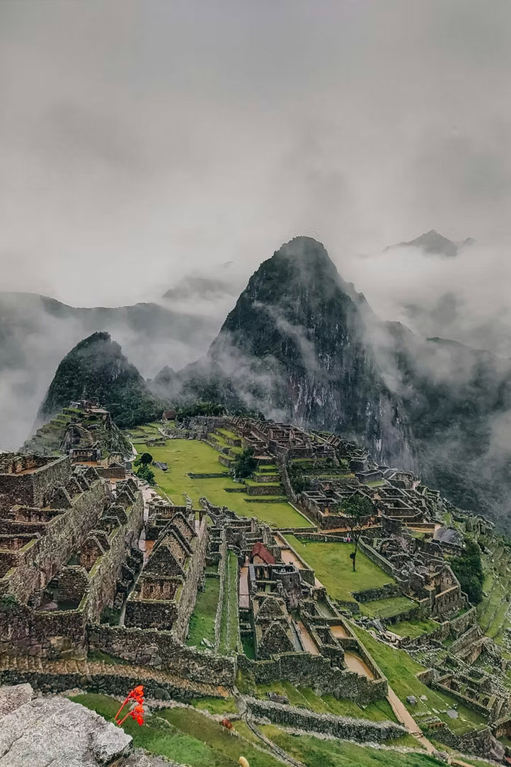 Misty view of Machu Picchu surrounded by clouds in the Peruvian Andes