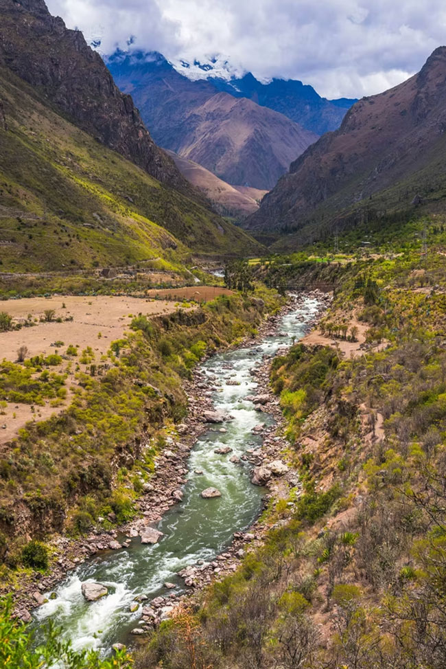 River flowing through a scenic Andean valley surrounded by mountains