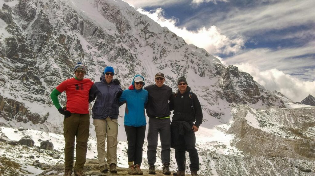 Group of hikers standing at high altitude during Ausangate trek in Peru